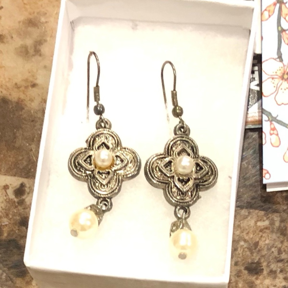 Intricate gold toned pieced dangle earrings with Pearl style accents